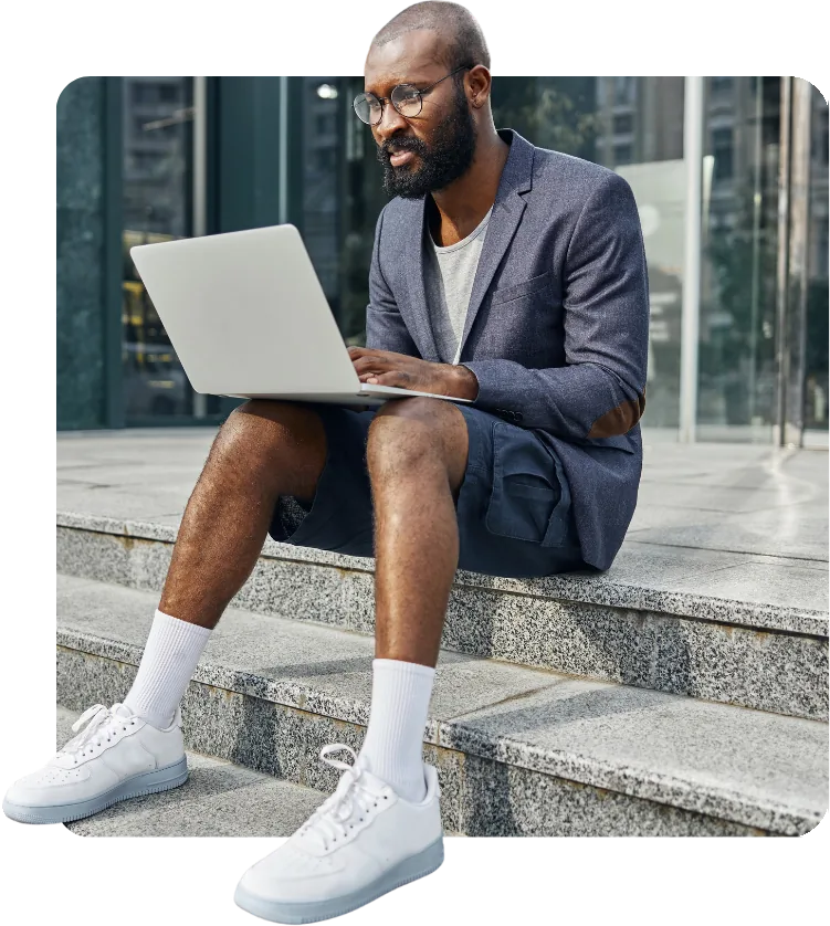 Professional reviewing business verification results on a laptop