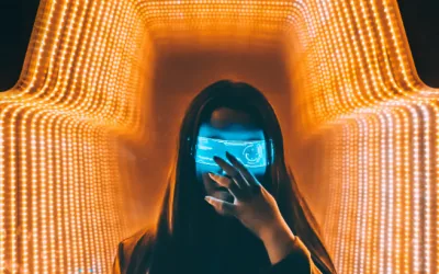 A woman wearing an illuminated augmented-reality visor, surrounded by a tunnel of orange light